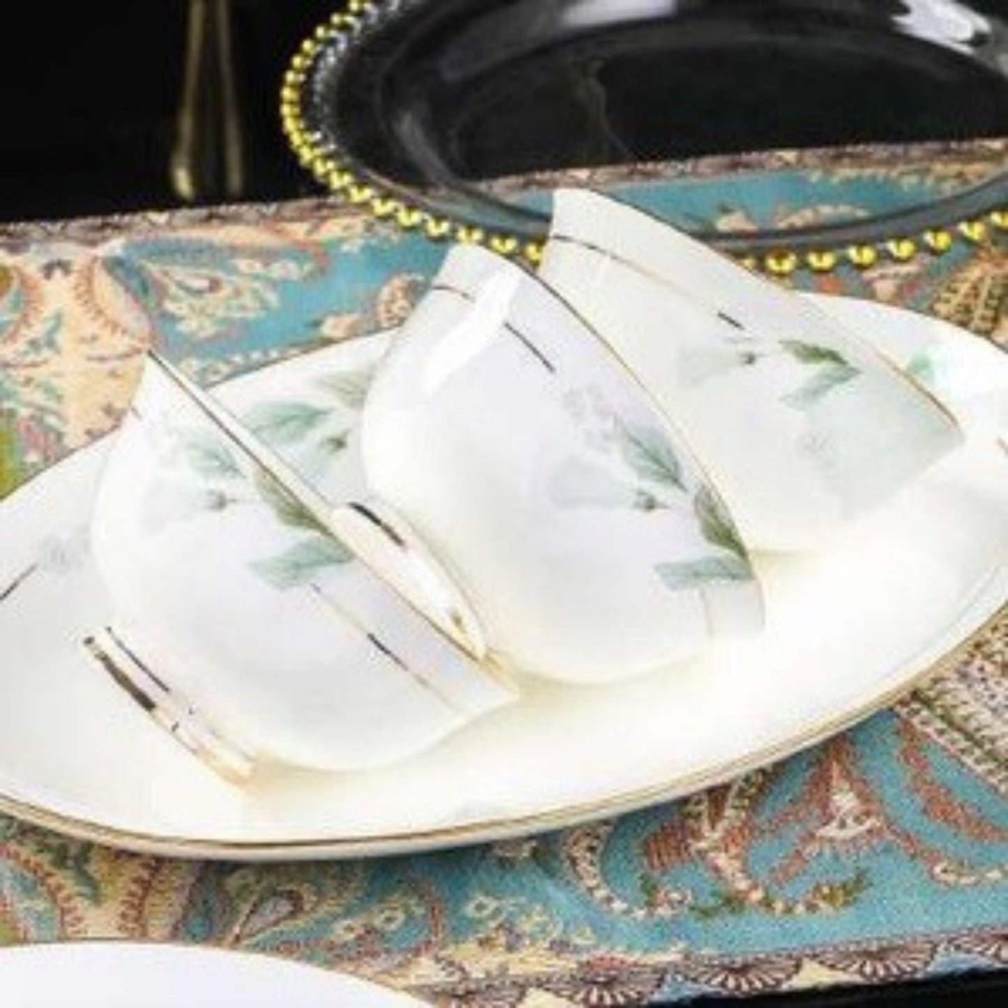 Verdant Elegance bone china crockery set with green leaves motif and golden edges