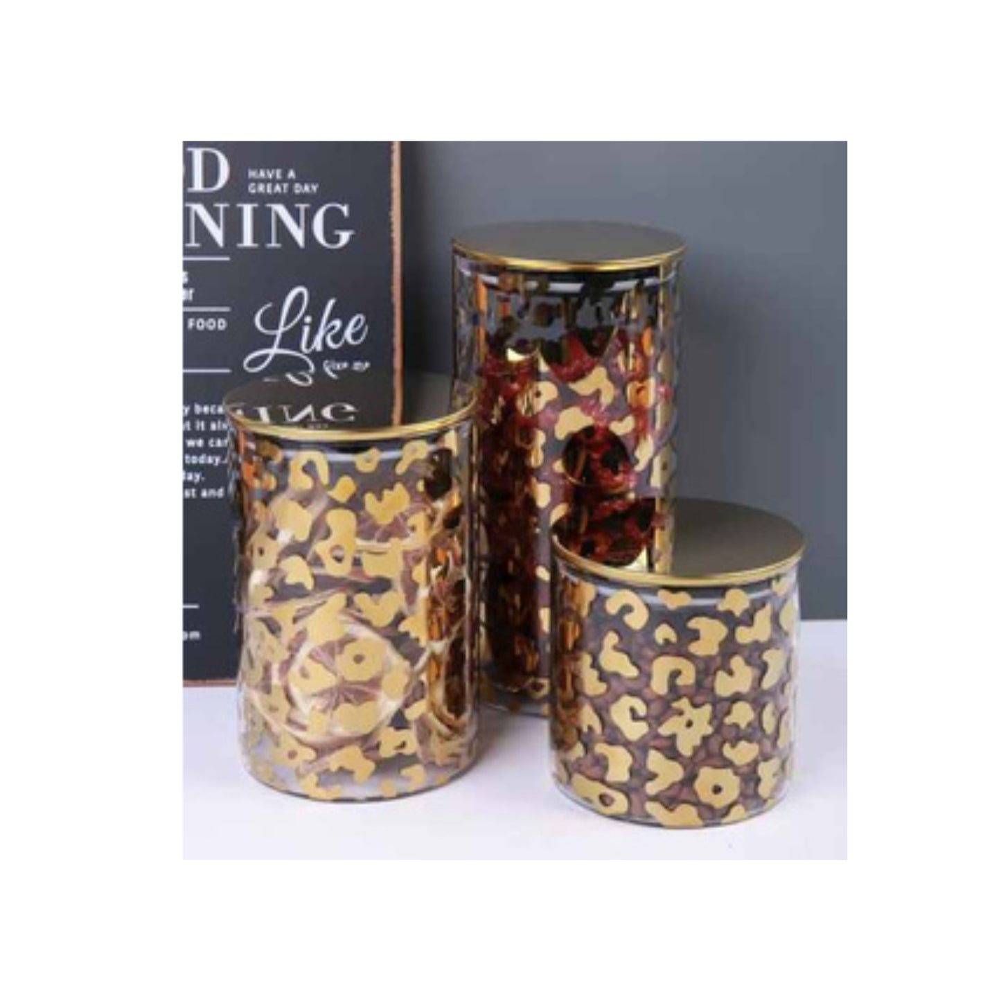 Glass jar with golden lid and assorted decorative patterns