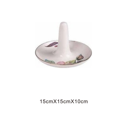 White ceramic animal-face bowl with golden edges and shiny surface