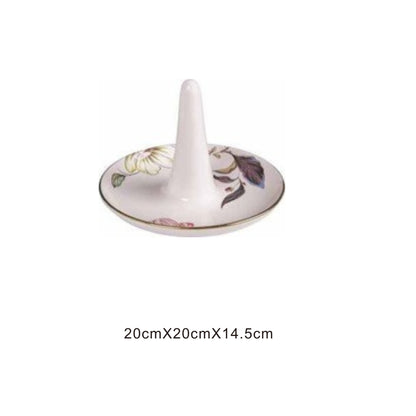 White ceramic animal-face bowl with golden edges and shiny surface