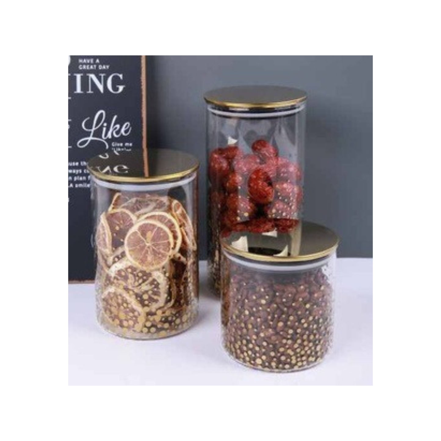 Glass jar with golden lid and assorted decorative patterns