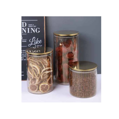 Glass jar with golden lid and assorted decorative patterns