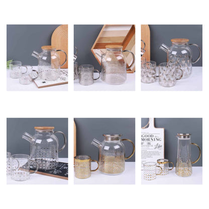 Glass teapot and mugs with metallic patterns in silver and gold