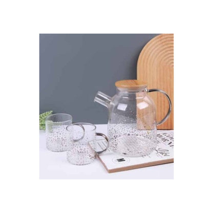 Glass teapot and mugs with metallic patterns in silver and gold