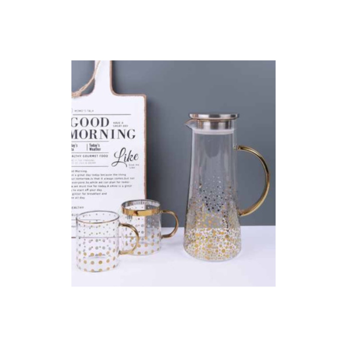 Glass teapot and mugs with metallic patterns in silver and gold