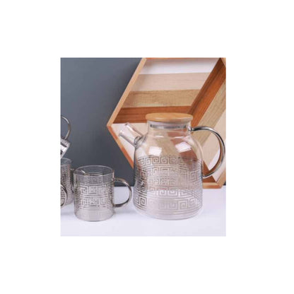 Glass teapot and mugs with metallic patterns in silver and gold