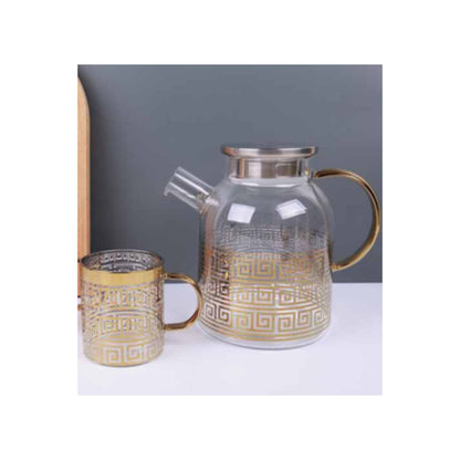 Glass teapot and mugs with metallic patterns in silver and gold