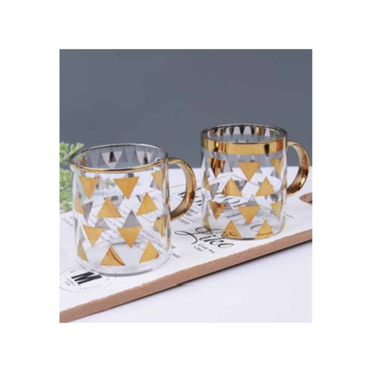 Glass mug with golden handle and golden triangles pattern
