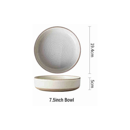 Round stoneware plates with engraved circle line pattern