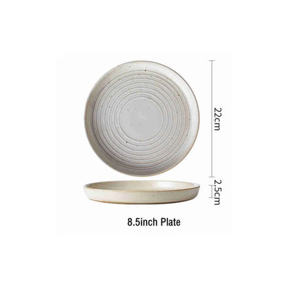 Round stoneware plates with engraved circle line pattern