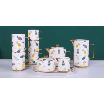 White Ceramic Tea and Coffee Set with Colorful Pineapple Pattern, Golden Edges, and Shiny Surface – 8-Piece Collection