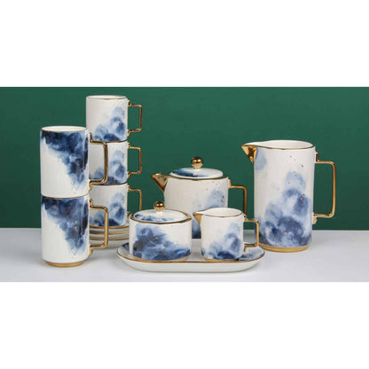 White Ceramic Tea and Coffee Set with Blue Smoke Effect, Golden Edges, and Shiny Surface – 8-Piece Collection
