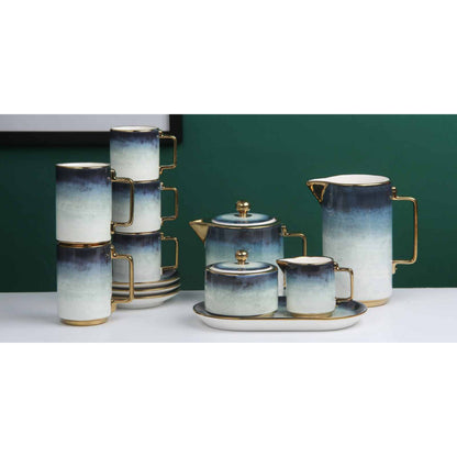 White Ceramic Tea and Coffee Set with Dark Blue Smokey Effect, Golden Edges, and Shiny Surface – 8-Piece Collection