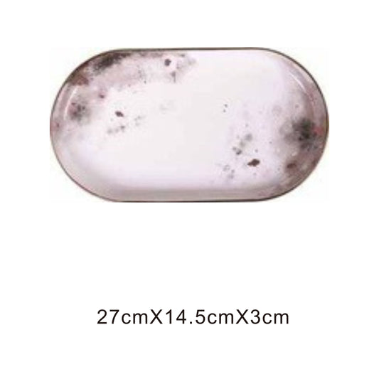 White ceramic tray with moon pattern, golden edges, and shiny surface