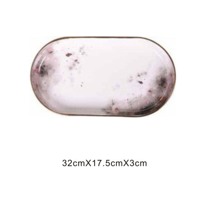 White ceramic tray with moon pattern, golden edges, and shiny surface