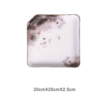 White ceramic square tray with moon pattern, golden edges, and shiny surface