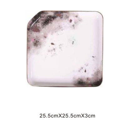 White ceramic square tray with moon pattern, golden edges, and shiny surface