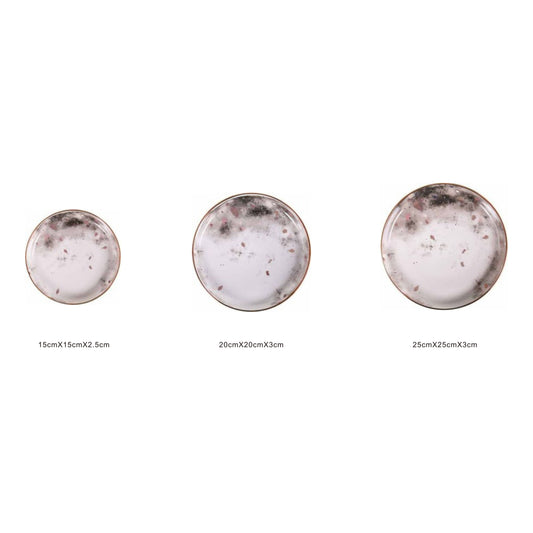 White ceramic round plate with moon pattern, golden edges, and shiny surface