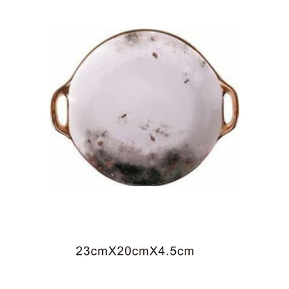 White ceramic irregular-shaped dish with moon pattern, golden edges, and shiny surface