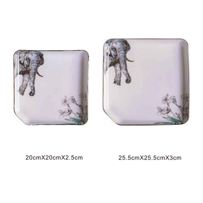 White ceramic square plate with animal face design, golden edges, and shiny surface