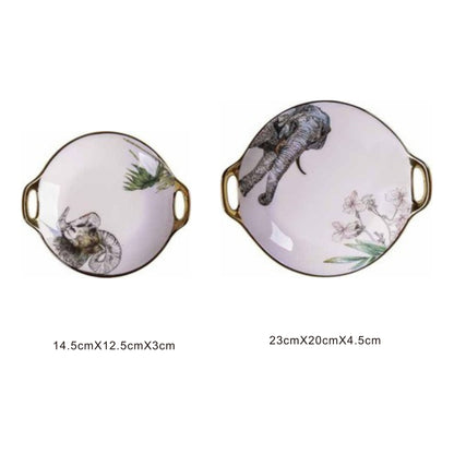 White ceramic round serving dish with animal face design, golden edges, and shiny surface