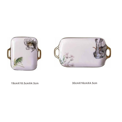 White ceramic rectangular serving dish with animal face design, golden edges, and shiny surface