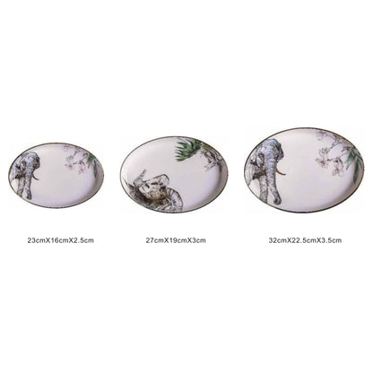 White ceramic oval serving dish with animal face design, golden edges, and shiny surface