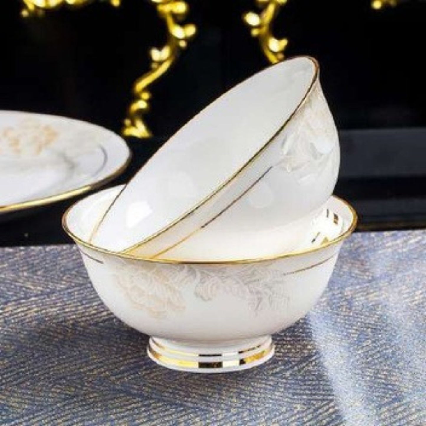 Delicate Elegance bone china crockery set with floral pattern, golden lines, and gilded edges