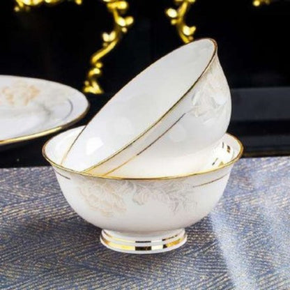 Delicate Elegance bone china crockery set with floral pattern, golden lines, and gilded edges