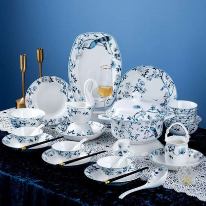 Blue Peacock bone china crockery set with peacock, leaves, and vine motif