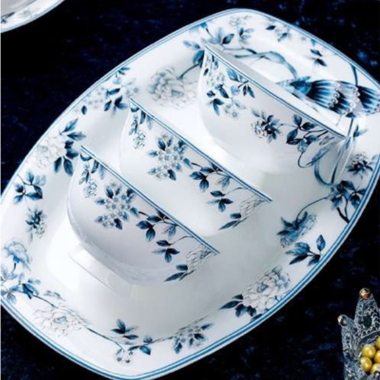 Blue Peacock bone china crockery set with peacock, leaves, and vine motif