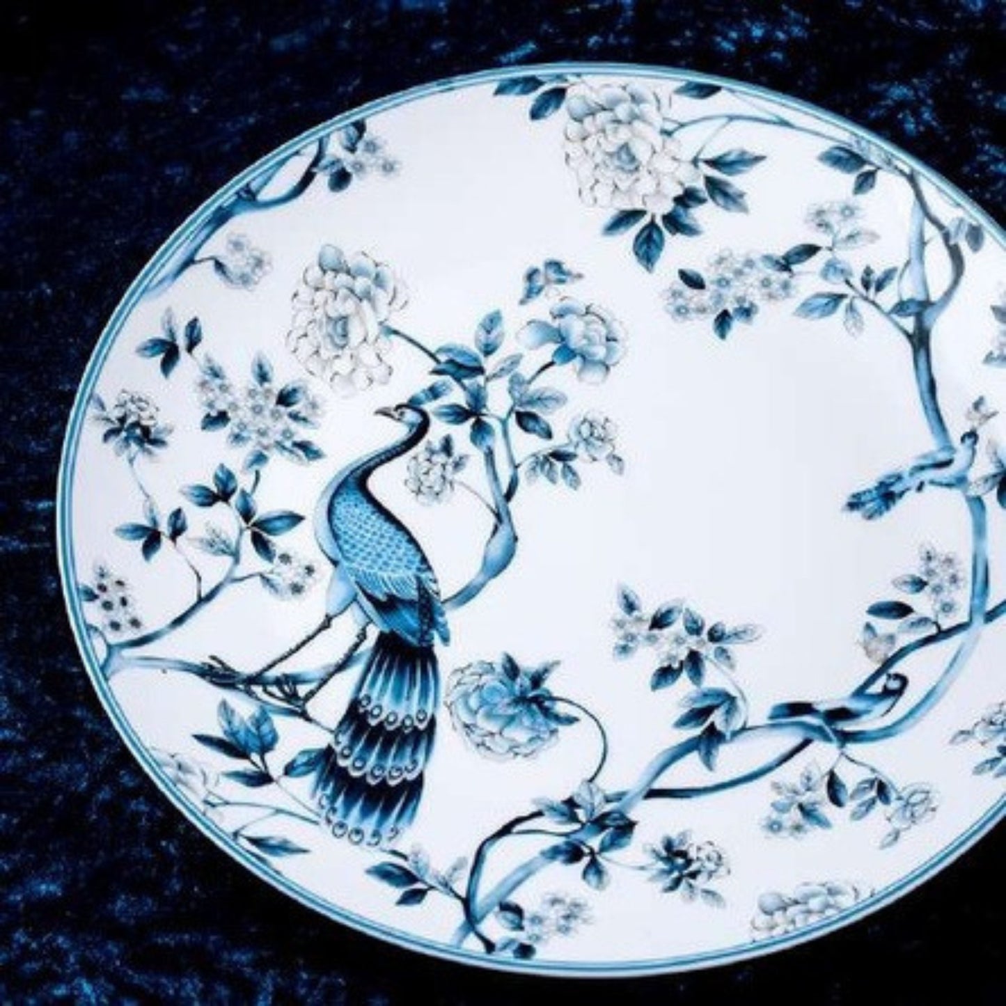 Blue Peacock bone china crockery set with peacock, leaves, and vine motif