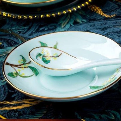 Golden Autumn Osmanthus porcelain crockery set with light blue base and green leaves and branches design
