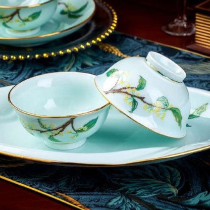 Golden Autumn Osmanthus porcelain crockery set with light blue base and green leaves and branches design