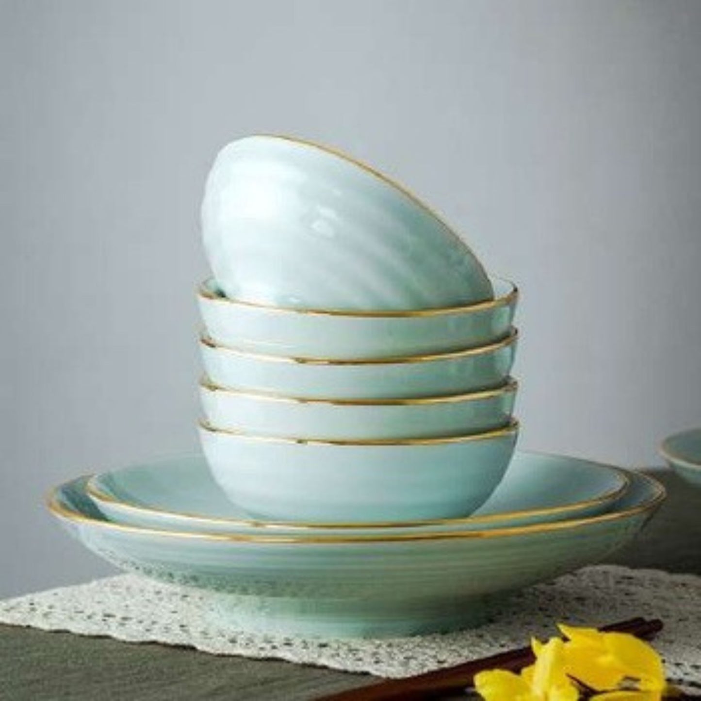 Celadon Elegance high white porcelain crockery set in light blue with golden edges