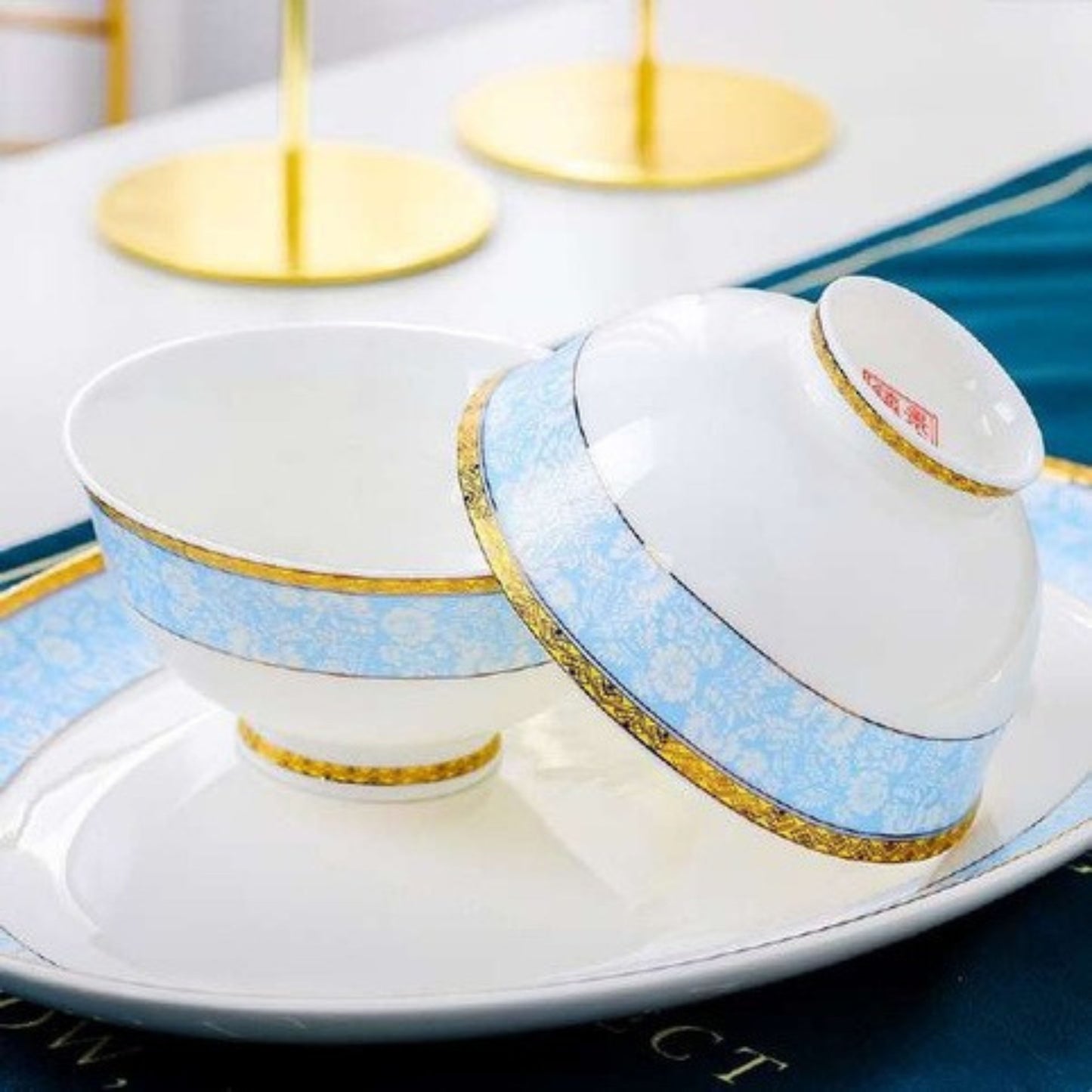 Azure Grace bone china crockery set with light blue floral design and golden edges